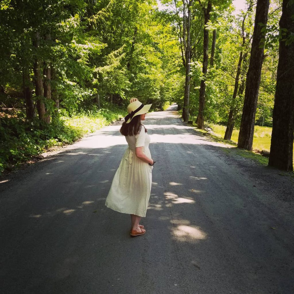 Paula Jean in a yellow sundress and hat. Connect with me!